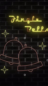Vertical video: Jingle Bells sign lighting on cue, bells lighting pulsing dimming into holiday glow