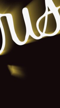 Vertical video: Bright strokes starting, lettering extruding, glowing gold, forming MERRY Christmas