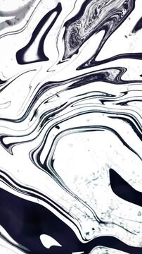 Vertical video: Soft stir starting B and W marble flowing veins waving blobs sliding showing ink spr