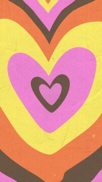 Vertical video: On loop retro hearts pulsing shifting hues, shrinking to center