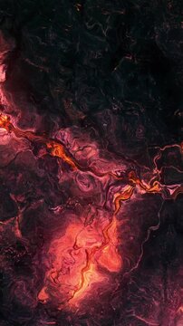 Vertical video: Initial flare sparking, molten vein pulsing and shifting, revealing evolving glow