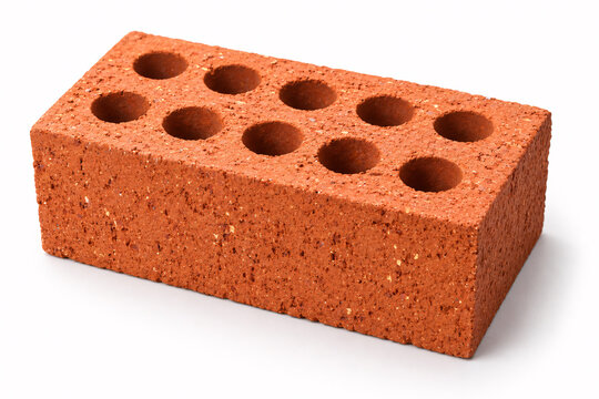 Single red brick with multiple holes a construction material for building and renovation isolated on a white background