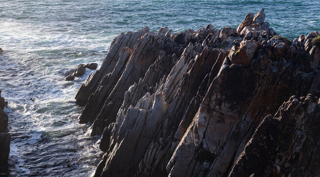 magnificent rocky coastline and Walker Bay of DeKelders, South Africa at sunset