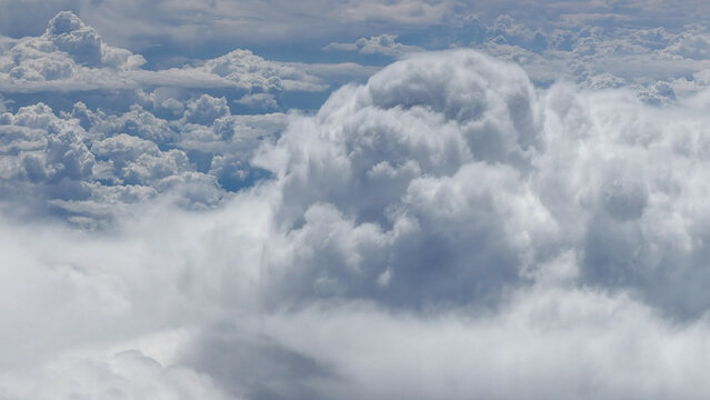 High-altitude view of clouds from airplane window