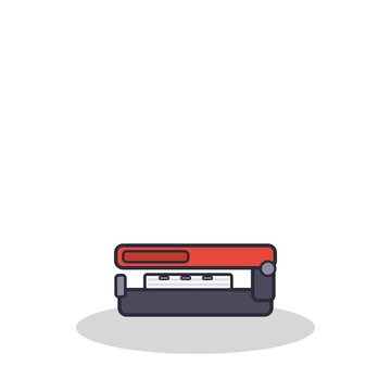 Stapler pressing staples into a paper stack