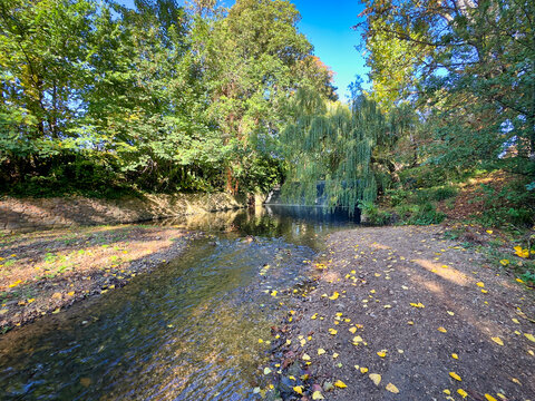 River Sid Flowing Through The Byes Riverside Park in Autumn, Sidmouth, Devon, UK