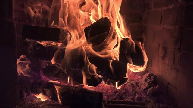 A strong fire with dancing flames and smoldering embers in fireplace or stove. A warm stove that provides heat during winter. Saving electricity, fuel and other resources. A crisis in heating sector.