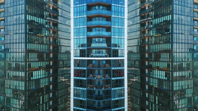 Mirrored modern glass skyscraper facade with symmetrical fractal architecture, Abstract reflection of contemporary office towers with geometric urban design, technology background 4k