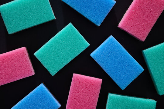 Close-up of a group of scouring sponges intended for household cleaning tasks.