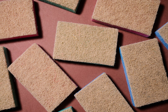 Close-up of a group of scouring sponges intended for household cleaning tasks.
