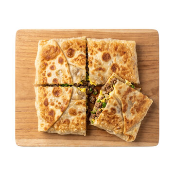 Freshly baked crispy mutabbaq stuffed with minced meat and vegetables served neatly on a rustic wooden board for traditional Middle Eastern dining concepts on transparent background