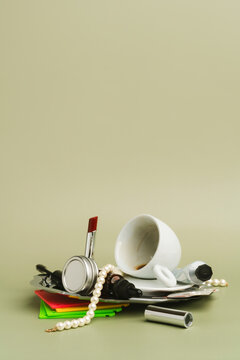 Studio shot of messy pile with floppy disks , cosmetics and coffee cup