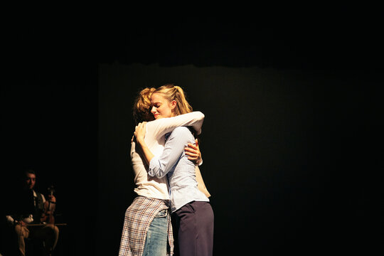 A tender embrace on stage