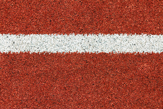 Red synthetic turf sports field abstract horizontal line background