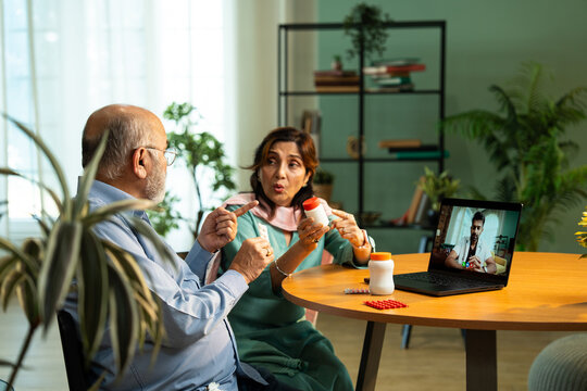 Indian Senior Couple Using Laptop for Telemedicine Consultation at Home