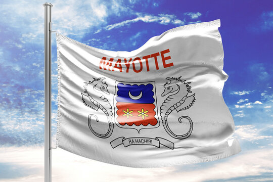 Mayotte flag waving in the wind against a blue sky