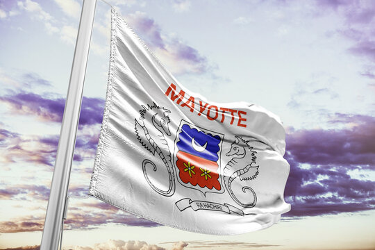 Flag of Mayotte waving outdoors against a cloudy sky background