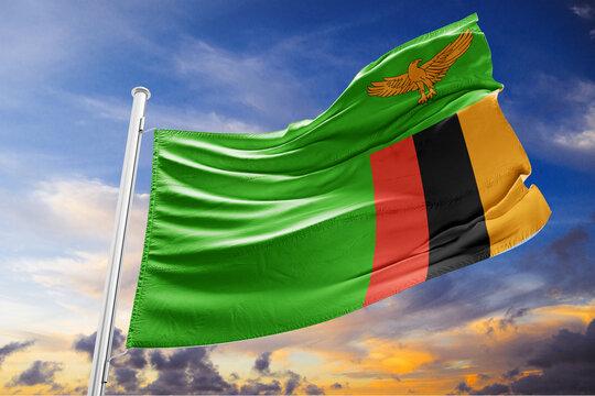 National Flag of Zambia Waving in the Wind against a Cloudy Sky