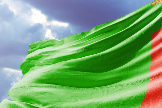Zambia Flag Waving in Wind Against Sky