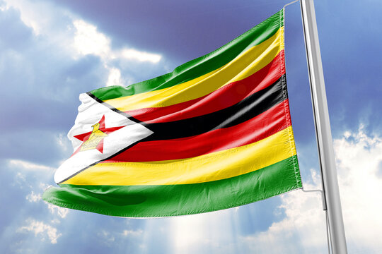 Zimbabwe Flag Waving against Blue Sky