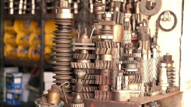 Mechanical gears, cogs, and machinery parts on display in workshop