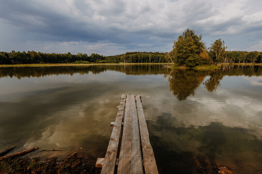 Wooden jetty on still pond, Plothener Teiche