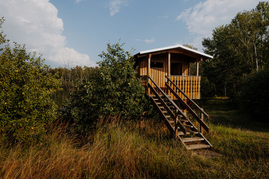 Wooden lookout tower in tall grass