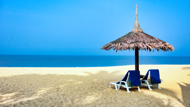 Parasol and sun loungers on Kho Ko Khao beach, Phang Nga, Thailand