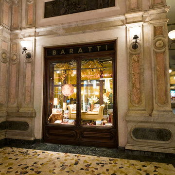 TURIN, ITALY - OCTOBER 21, 2026 - Baratti and Milano's cafe window displaying sweets in Turin's ornate marble arcade