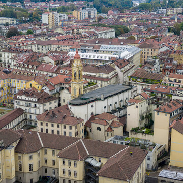 Turin's historic center stretching across the view, with terracotta rooftops and church towers