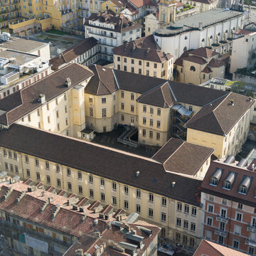 Turin city center, revealing historic rooftops and classical European architecture from above