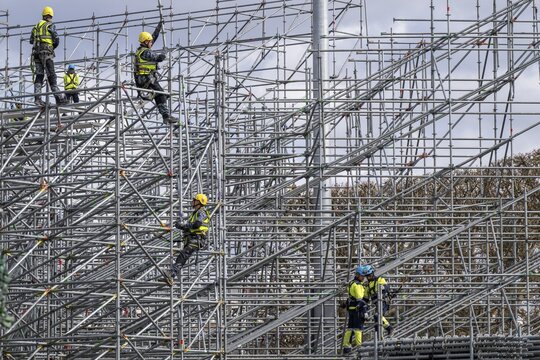 Construction workers on scaffolding, preparations for the Olympic Games in Paris 2024, Paris, France