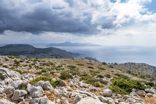 View over the island and coast to the sea, rocky landscape with macchia, Symi, Dodecanese, Greece