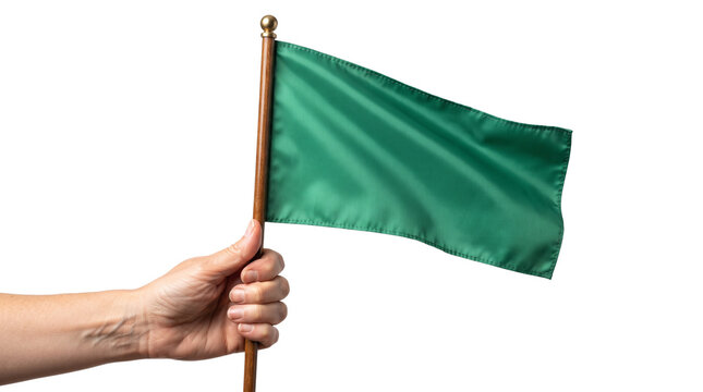 Green signal flag held in hand, small fabric banner on wooden pole, symbolic go sign for safety and sustainability, isolated on white.