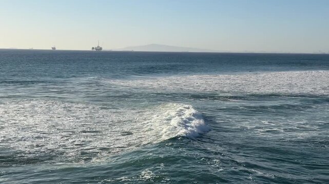 View of Large Ocean Waves at Huntington Beach California in Late Afternoon