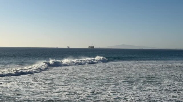 View of Large Ocean Waves at Huntington Beach California in Late Afternoon