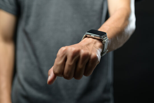 Close-up of Man Wearing Smartwatch on Wrist with Digital Display