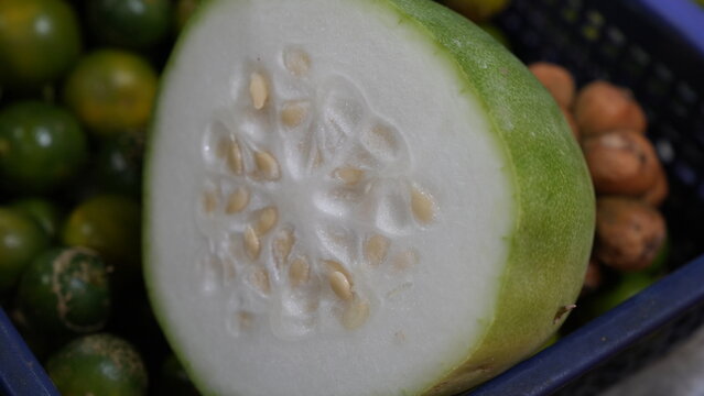 Fresh cut winter melon with seeds close up