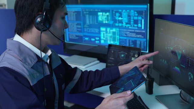 engineer logistics operator using GPS radar and real-time fleet management dashboard on computer.