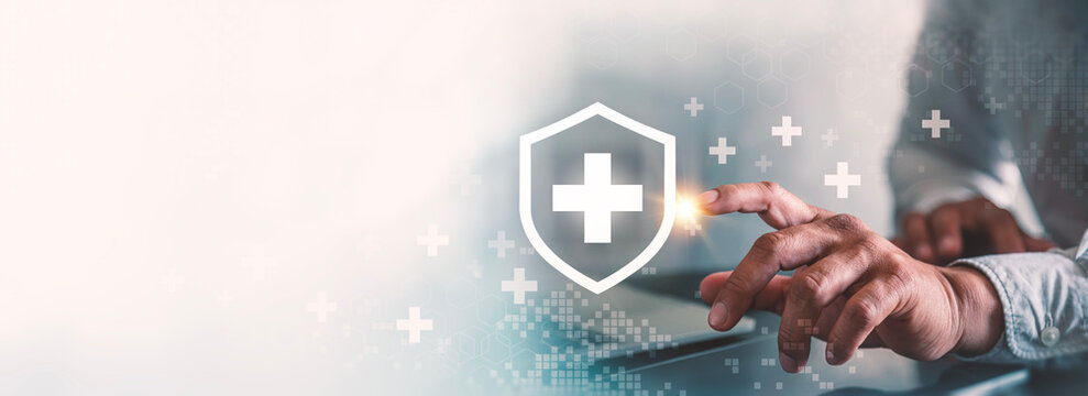 Health Insurance and Healthcare Protection Concept with Businessman Touching Shield Cross Icon.
