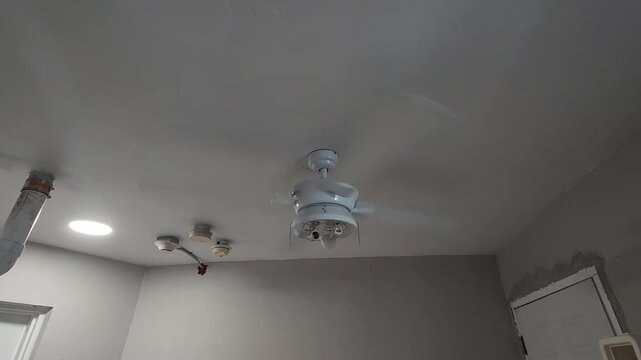Spinning Ceiling Fan in Indoor Room