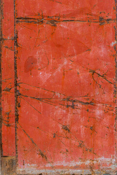 Weathered Orange-Red Metallic Surface Texture Background