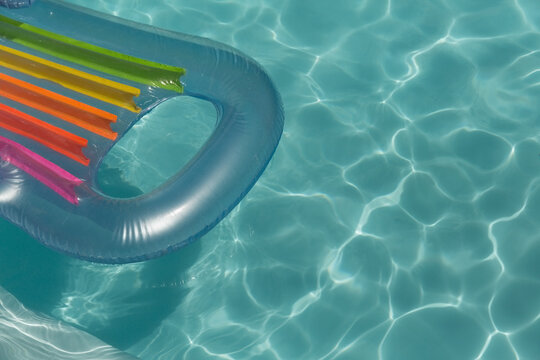 Inflatable tube floating in a swimming pool