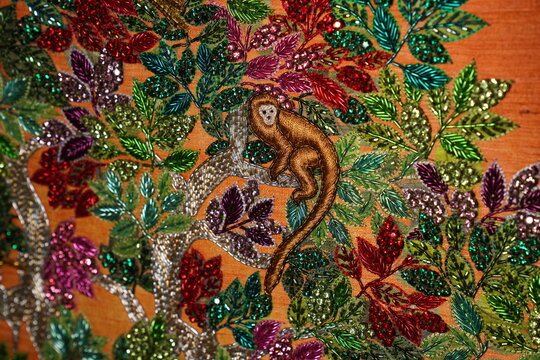Decorative Indian folk art featuring a monkey amidst vibrant foliage