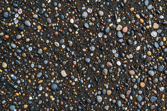 Smooth Ocean Tumbled Basalt And Shell Sand Macro Flat Lay Background