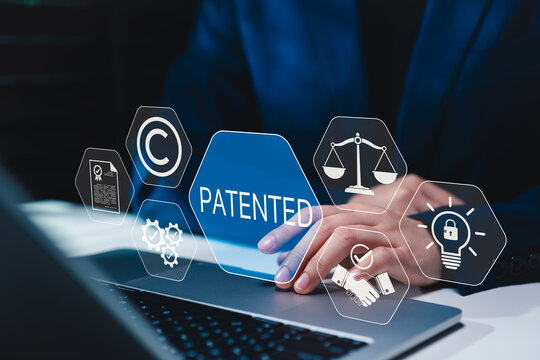 Patent protection and intellectual property management concept. Person using laptop digital patented interface, legal compliance, innovation security, copyright licensing, business technology workflow