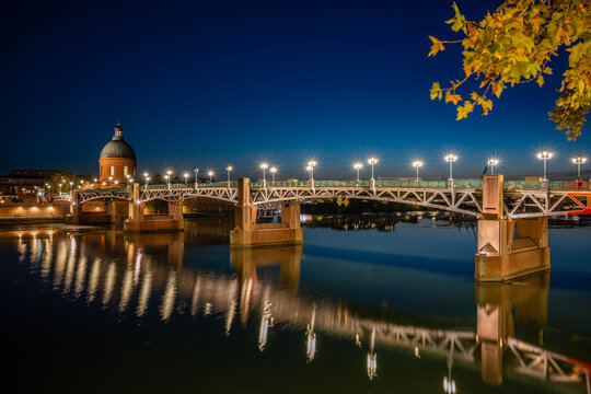 Toulouse, France - September 20, 2026: The illuminated Saint-Pierre Bridge and the Dome de la Grave in Toulouse at Blue Hour