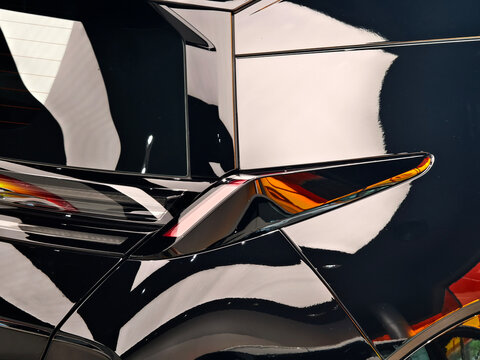 modern car side and driver door reflecting bright sunlight