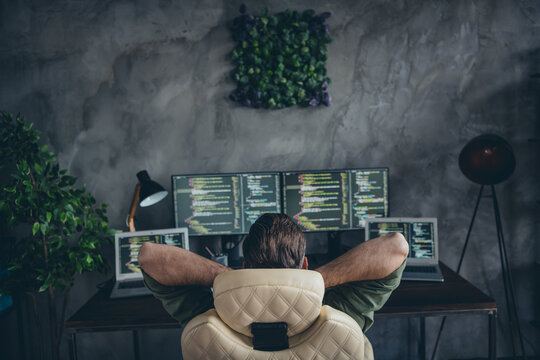 Back rear spine view photo of webdesign geek guy hand stretch sit desk end java script write code platform password in workspace