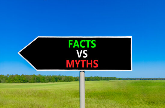Facts vs versus myths words symbol. Concept words Facts vs Myths on beautiful black road sign. Beautiful blue sky green grass background. Business and facts vs versus myths concept. Copy space.